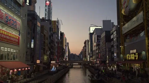 Sunset timelapse of Dotonbori, Osaka in Japan, sunny day - 4k Stock Footage 299867192