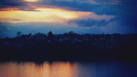Sunset, timelapse. Dramatic sunset over the village Stock Footage 236855416