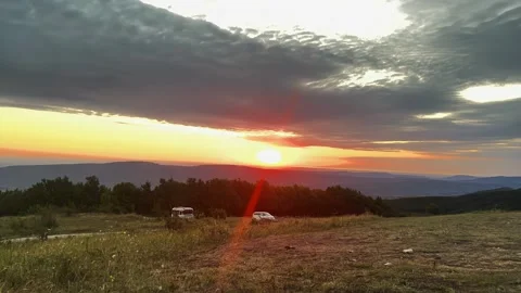 Sunset timelapse of floating clouds in a mountainous area, timelapse Stock Footage 260003913