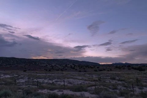Sunset timelapse hidden behind storm clouds in New Mexico 4k Video stock 115501609