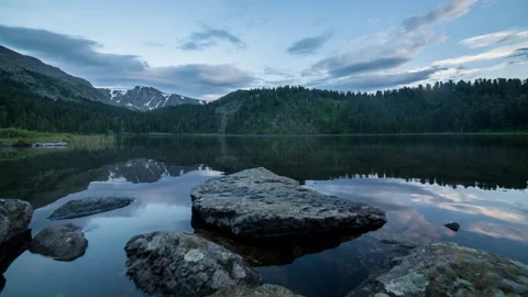 Sunset timelapse on a mountain lake Video stock 178377251