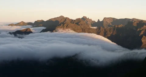 Sunset timelapse with moving clouds above the peaks - Madeira Stock Footage 231776958