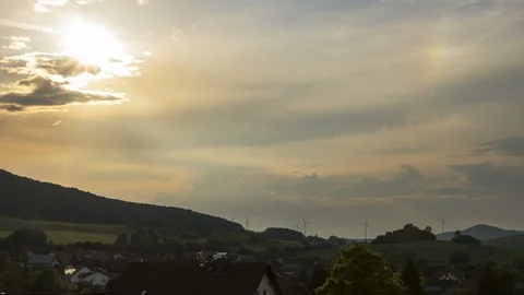 Sunset timelapse of moving clouds with town Stock Footage 94931188