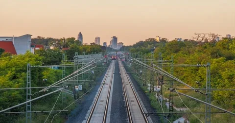 Sunset timelapse over Riedbahn railway and Frankfurt skyline Germany Stock Footage 336116371