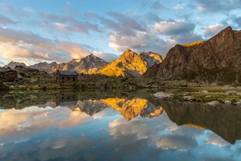 Sunset timelapse with reflexion on the lake of the Refuge of Vallonpierre Stock Footage 139798463