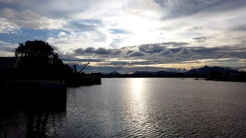 Sunset Timelapse in Sarawak River, Kuching, Malaysia with Mt Serapi  Stock Footage 104081746