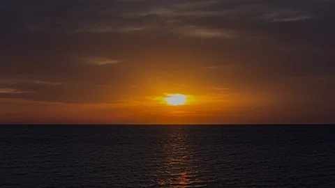 Sunset timelapse on the sea 4K Video stock 126934181