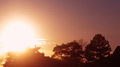Sunset Timelapse Silhouettes of trees and houses Time lapse Scandinavia Stock Footage 101971432
