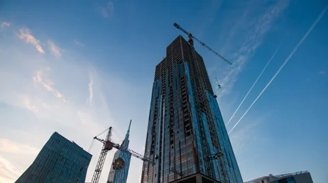 Sunset timelapse of skyscrapper construction works, zoom in Stock Footage 61544351