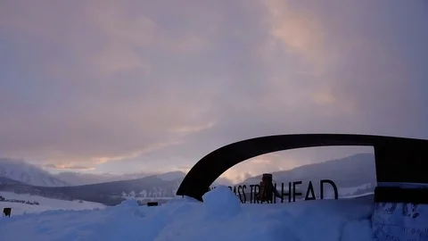 Sunset timelapse at Snodgrass Trailhead clouds passing windy deep snow Stock Footage 105173012