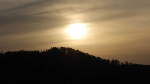 Sunset timelapse with sun covered by clouds Stock Footage 89670831