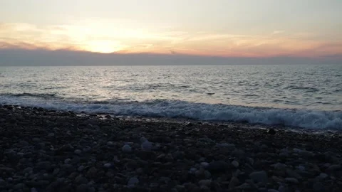 Sunset timelapse, the sun goes down below the skyline among the red clouds,.. Stock Footage 237360559