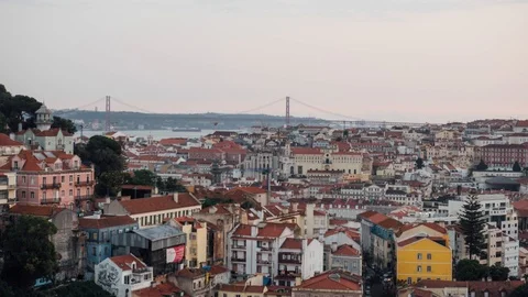 Sunset timelapse of sun rays over the Lisbon cityscape (Baixa district) Portugal Stock Footage 97722381