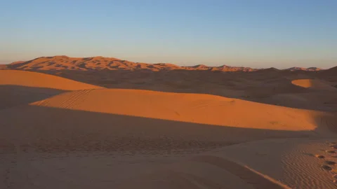 Sunset Timelapse wide shot of dunes of Erg Chebbi Desert at Sunset, Morocco Stock Footage 104150239