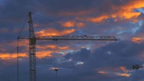 Sunset timelipse of construction cranes and beautiful clouds on background Video stock 91881083