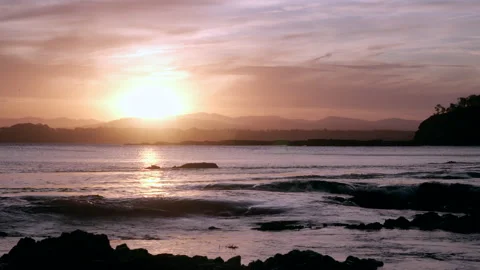 Sunset at Tomakin with waves crashing on the rocks Stock Footage 137520800