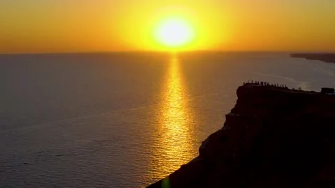 Sunset on top of a mountain overlooking the sea Stock Footage 139162660