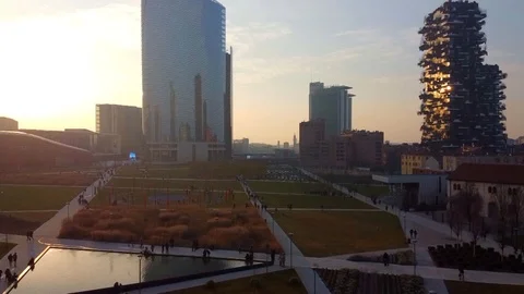 Sunset on the tower Bosco Verticale and Gae Aulenti Square in Milan Stock Footage 123784856