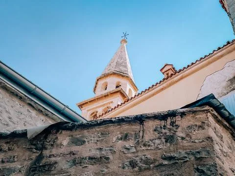 Sunset tower view, conservation architect examining intricate masonry and Stock Photos