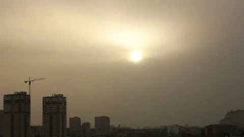 Sunset in town in overcast sky Video stock 96336515