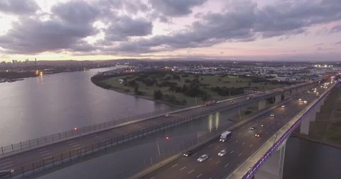 Sunset traffic in Brisbane at gateway bridge aerial view Stock Footage 102821227