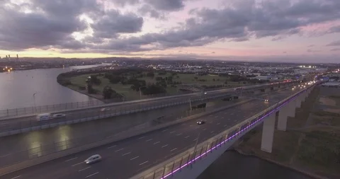 Sunset traffic in Brisbane at gateway bridge aerial view Stock Footage 102821255