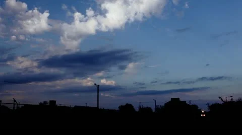 Sunset train passing through, with indigo sky overhead Stock Footage 12337977