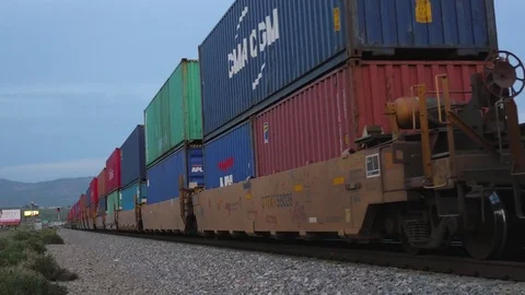 Sunset train roars past in Beaumont California Stock Footage 73816523