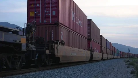 Sunset train roars past in Beaumont California Stock Footage 73816556