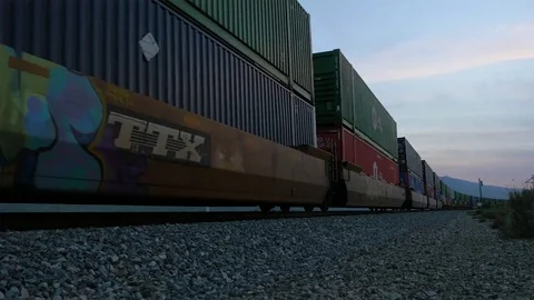 Sunset train roars past in Beaumont California Stock Footage 73816780
