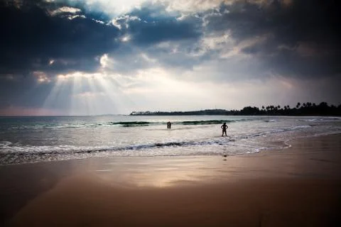Sunset on tropical beach Stock Photos