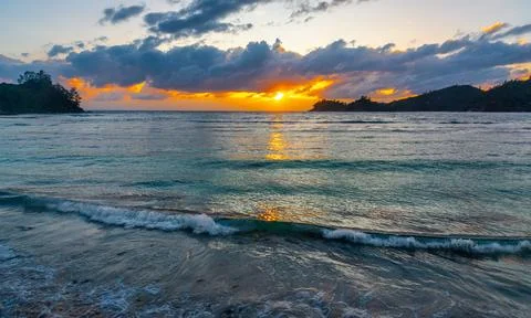 Sunset in a tropical beach Stock Photos