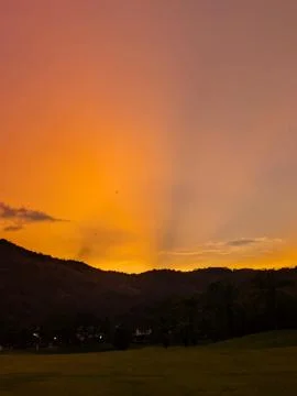 Sunset in the tropics with a bridge and clouds Foto stock