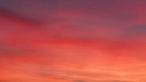 Sunset turns the sky orange. Stock Photos