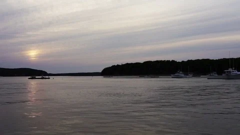 Sunset, twilight, dusk and sun path reflection in Bar Harbor, Maine village Stock Footage 80199618