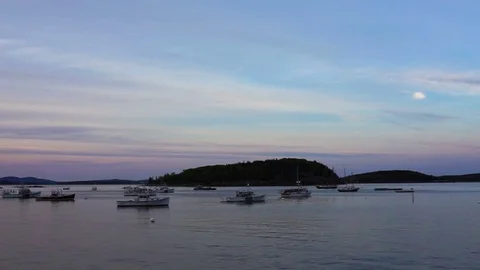 Sunset, twilight, dusk in Bar Harbor, Maine village marina with empty boats Stock Footage 80201613