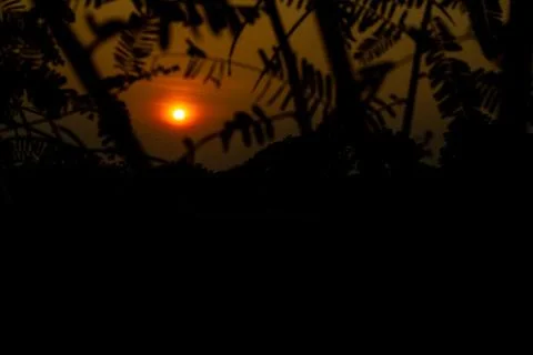 The sunset is typically considered to be part of the evening Stock Photos