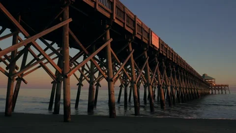 Sunset under a beach boardwalk Stock Footage 167372766