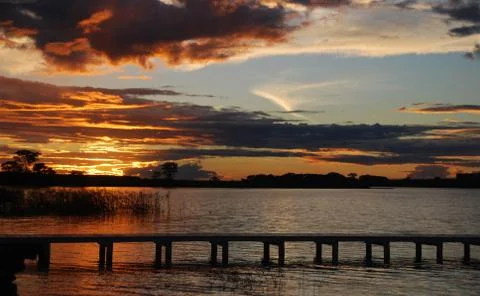 Sunset under a bunch of clouds Stock Photos