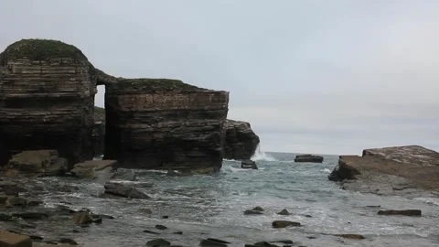 Sunset under a grey sky in a Cantabrian beach Stock Footage 306706639