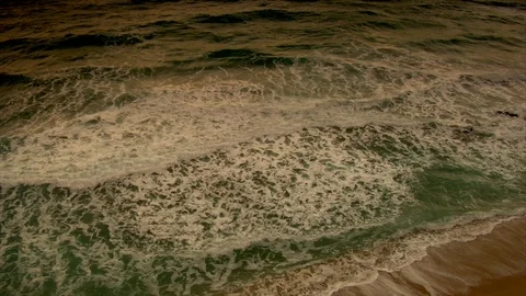 Sunset under horizon. Clouds and ocean waves view from beach. slomo pan up Stock Footage 102532245