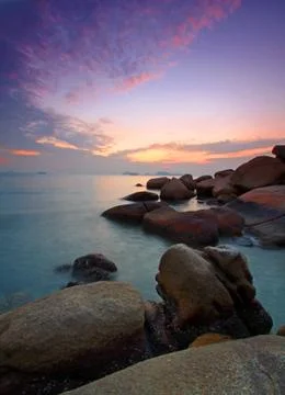 Sunset under long exposure along coast Foto stock