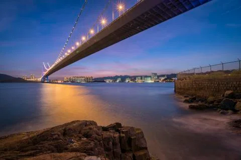 Sunset under tha Tsing Ma Bridge of Hong Kong Stockfoto's