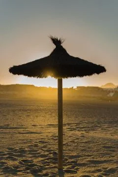 Sunset under the umbrella Stock Photos