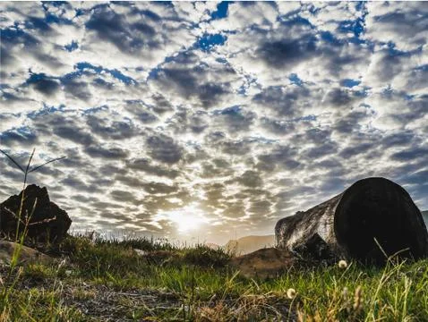 Sunset from a unique low angle with moody sky, clouds, HDR Stock Photos