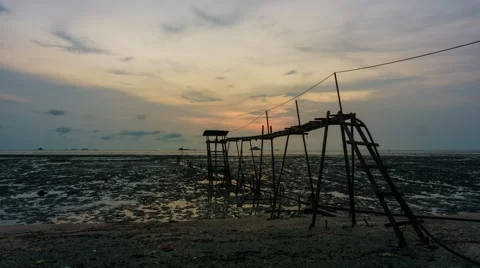 Sunset With Unique Wooden Construction On Beach Stock Footage 42415322