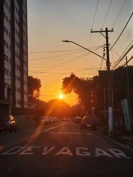 Sunset in urban landscape with sun rays Stock Photos