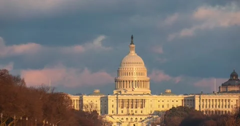 Sunset at the US Capitol building on a stormy day in February Stock Footage 148185301