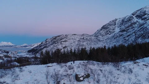 A sunset in the valley, the sky is a gradient of color from blue to pink. Stock Footage 106924877