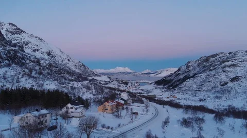 A sunset in the valley, the sky is a gradient of color from blue to pink Stock Footage 106924896